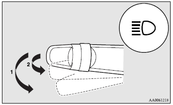 When the lamp switch is in the “ ” position, the beam changes from high to low