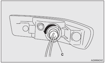 4. Remove the socket and bulb assembly (C) together by turning it anticlockwise,