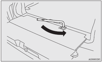 2. Loosen the tyre hanger installation bolt by turning it anticlockwise with