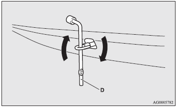 3. Use the wheel nut wrench (D) to firmly attach the towing hook.