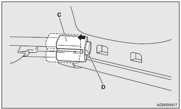 1. Move one of the sliders (C) toward the inside of the vehicle, and fit the