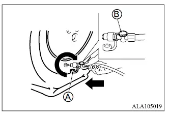 Mitsubishi Outlander tire compressor hose connected to tire valve and power outlet