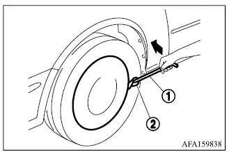 Mitsubishi Outlander wheel cover removal using the jack rod and protective cloth